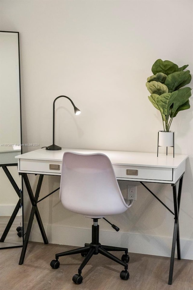 home office with light wood-type flooring