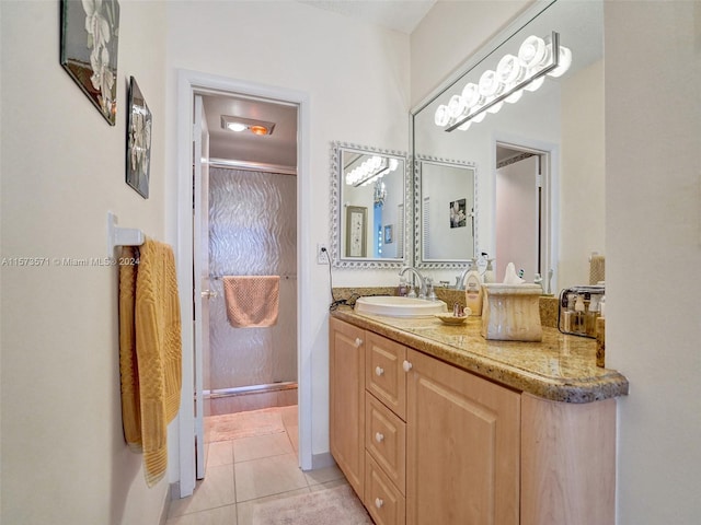 bathroom with vanity and tile floors