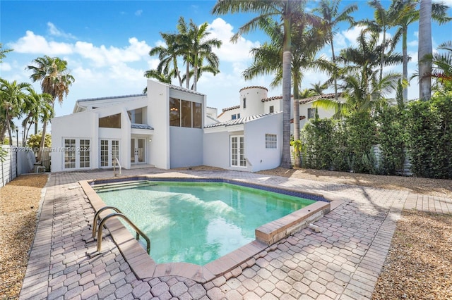 view of pool featuring french doors and a patio