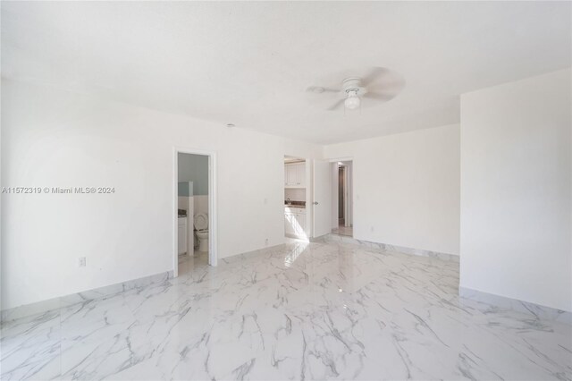 tiled empty room with ceiling fan