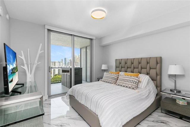 bedroom featuring access to exterior and floor to ceiling windows