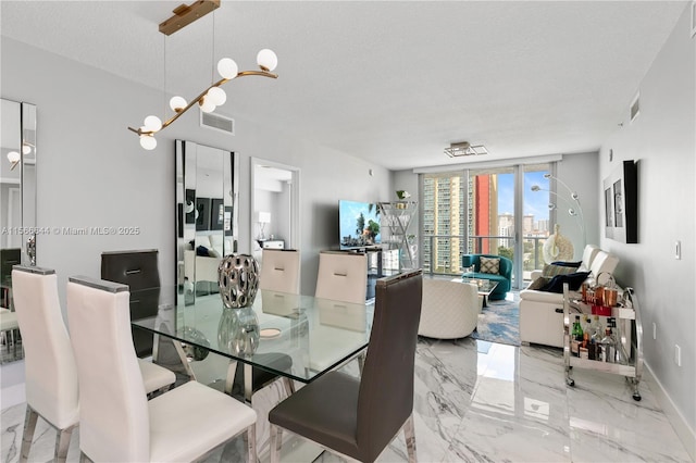 dining room featuring a textured ceiling