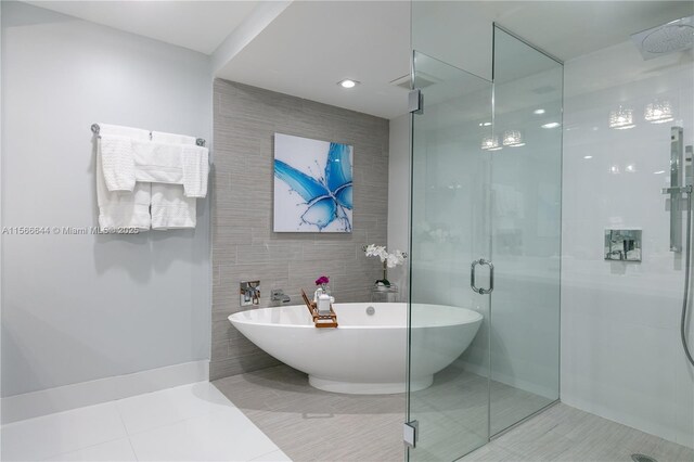 bathroom featuring vanity and a shower with door