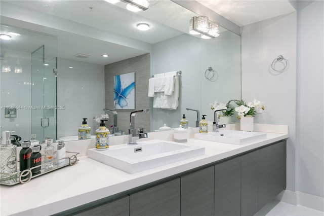 bathroom featuring vanity and an enclosed shower