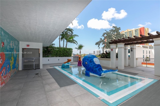 view of swimming pool featuring a pergola and a patio