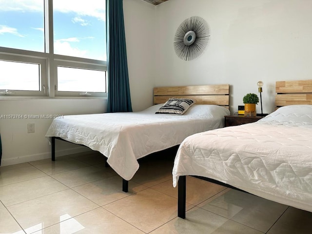 bedroom with light tile floors