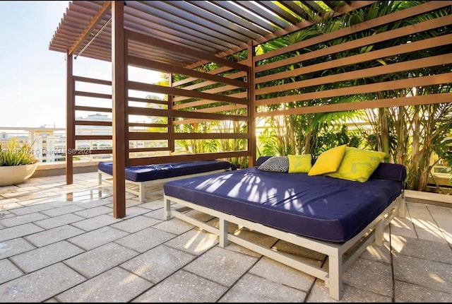 view of patio featuring outdoor lounge area and a pergola