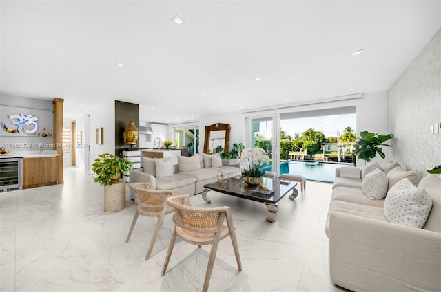 tiled living room featuring sink and beverage cooler