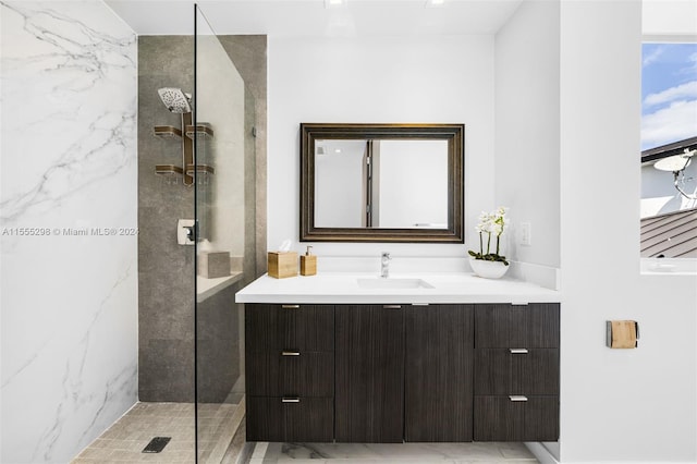 bathroom featuring walk in shower, tile floors, and vanity