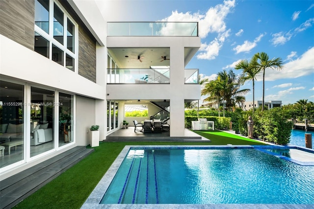 exterior space featuring a patio area, ceiling fan, and an outdoor hangout area