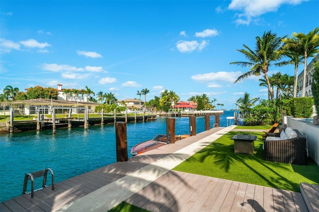 dock area featuring a yard and a water view