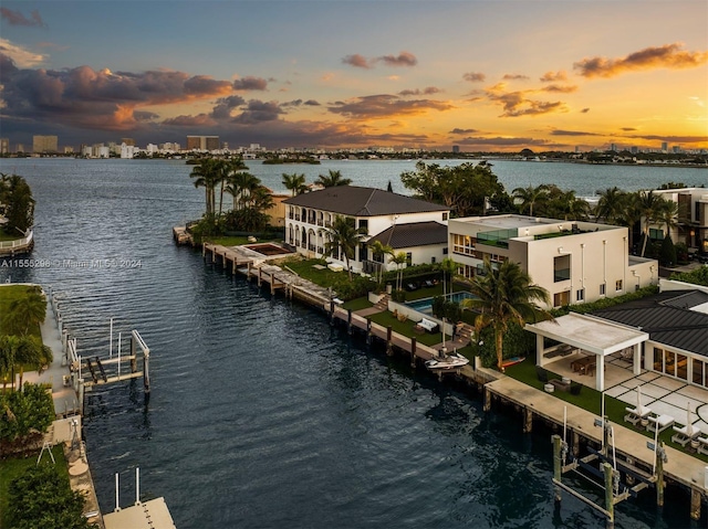 aerial view at dusk with a water view