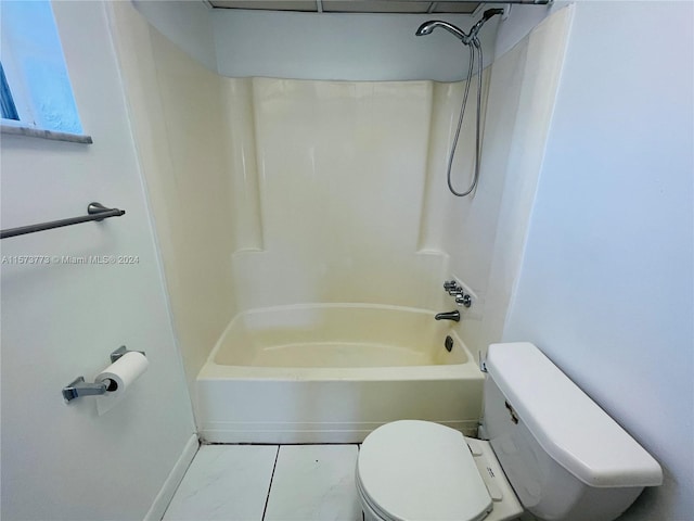 bathroom with shower / bathing tub combination, toilet, and tile floors