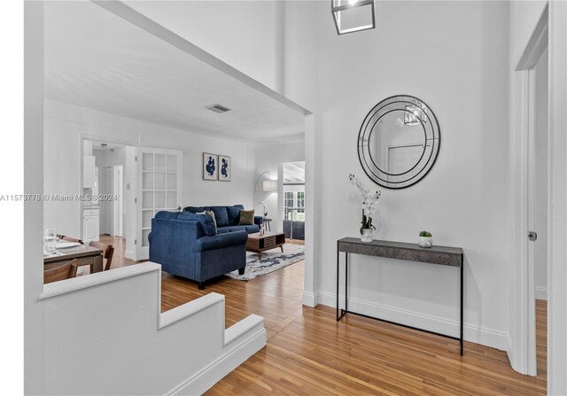 corridor featuring light hardwood / wood-style floors