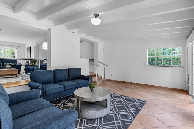 living room featuring tile flooring and beamed ceiling