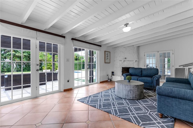 living room with plenty of natural light, french doors, and tile flooring