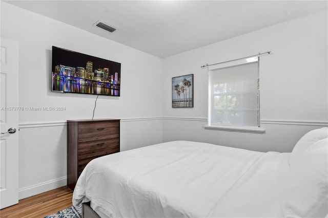 bedroom with light hardwood / wood-style flooring