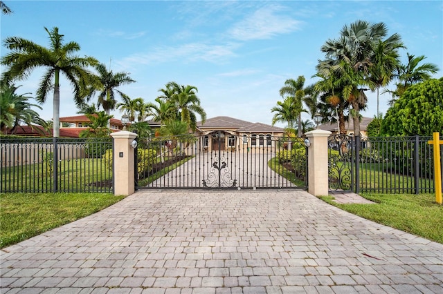 view of gate featuring a lawn