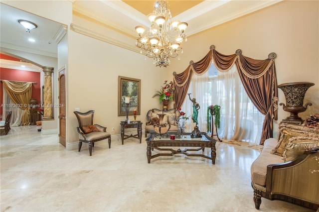 living area featuring an inviting chandelier, crown molding, tile floors, and decorative columns