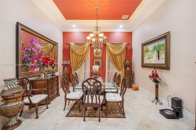 dining space with a chandelier, crown molding, tile floors, and a tray ceiling