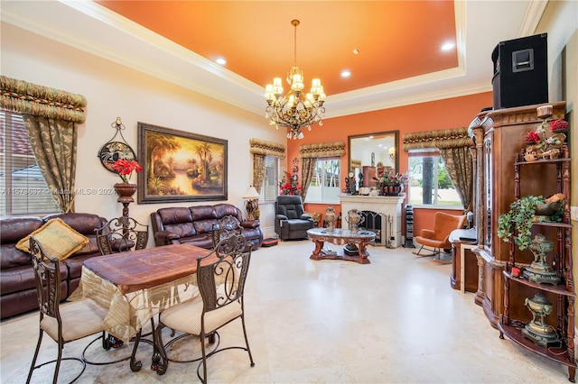 tiled dining space featuring ornamental molding, a notable chandelier, and a tray ceiling