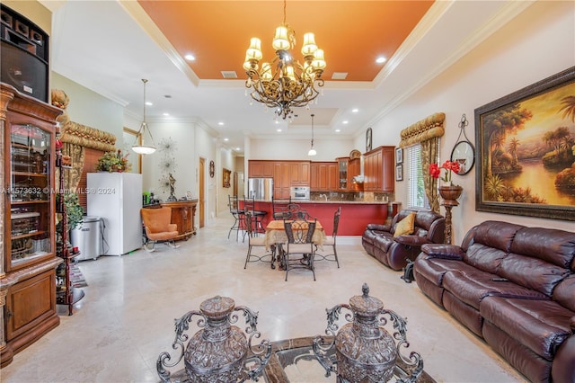 living room with crown molding, a tray ceiling, light tile floors, and a chandelier