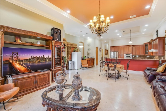 tiled living room featuring ornamental molding, a tray ceiling, and an inviting chandelier