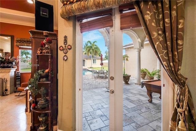 doorway to outside with tile flooring, french doors, ornamental molding, and pool table