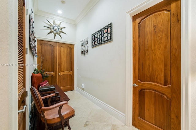 sitting room featuring crown molding and light tile floors