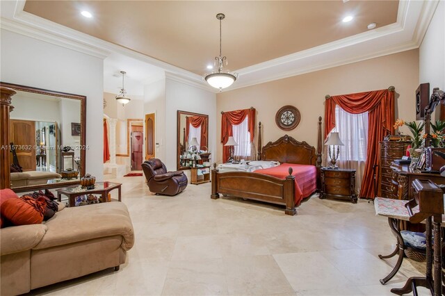 bedroom with a tray ceiling and tile flooring