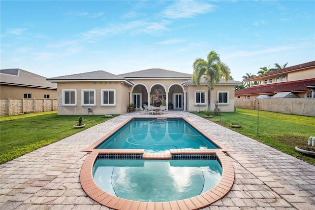 view of pool with a yard and a patio