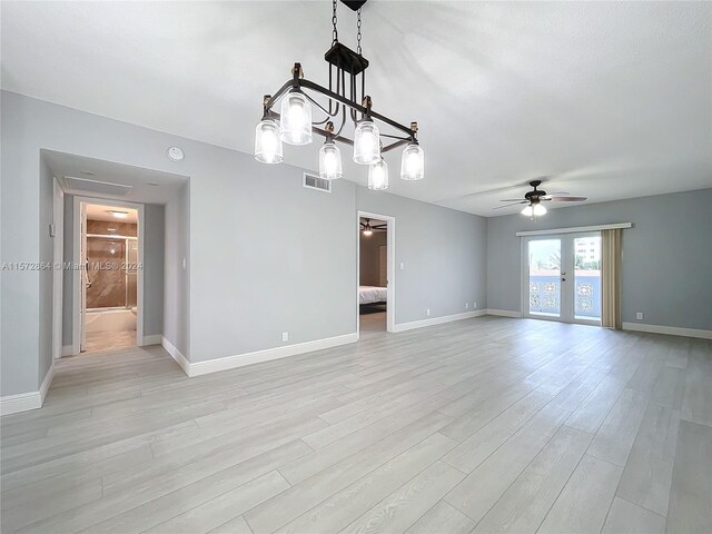 spare room featuring ceiling fan and light hardwood / wood-style floors