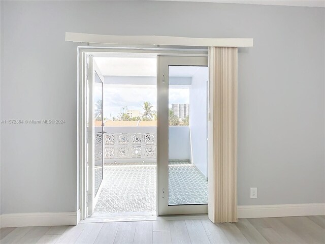 doorway with light hardwood / wood-style flooring