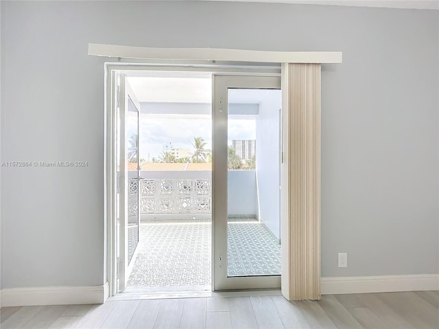 doorway to outside with light hardwood / wood-style floors