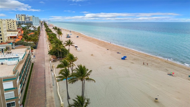 birds eye view of property featuring a water view and a view of the beach