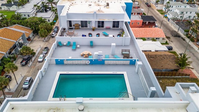 exterior space featuring a community pool and a patio area