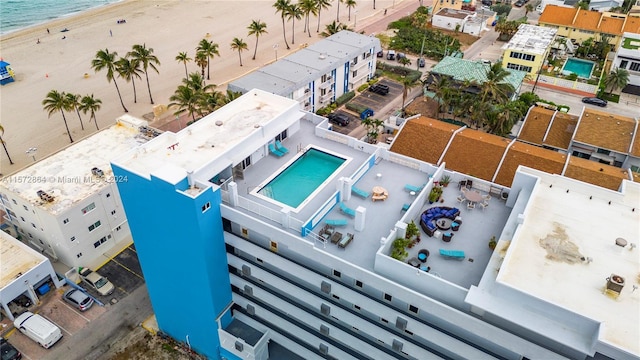 bird's eye view featuring a view of the beach and a water view