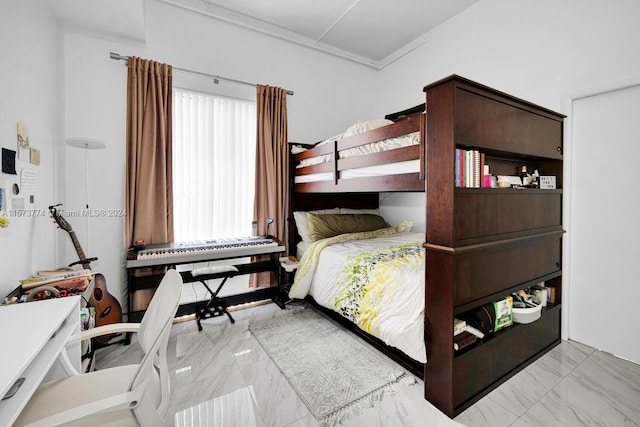 bedroom with crown molding and light tile floors