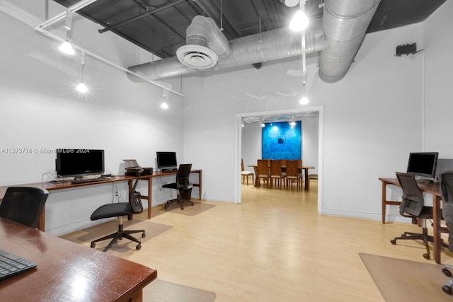 office space with light wood-type flooring