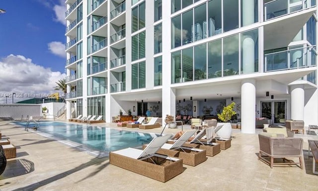 view of pool featuring a patio area