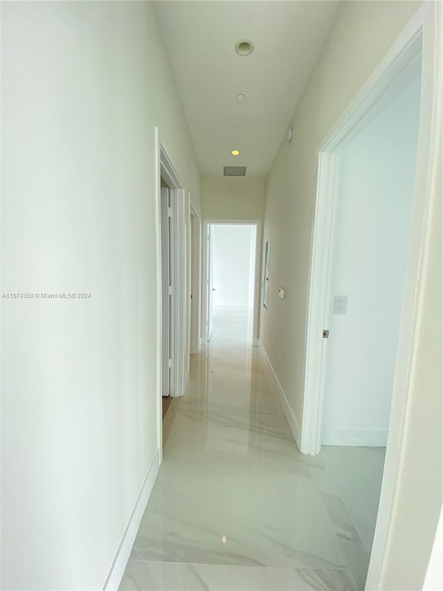 hallway with tile floors