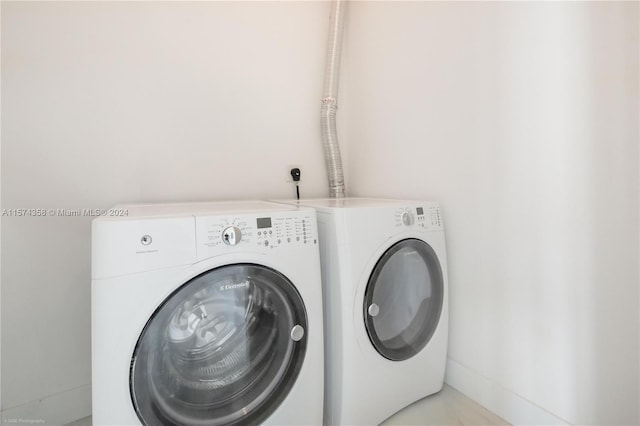 washroom featuring washer and dryer