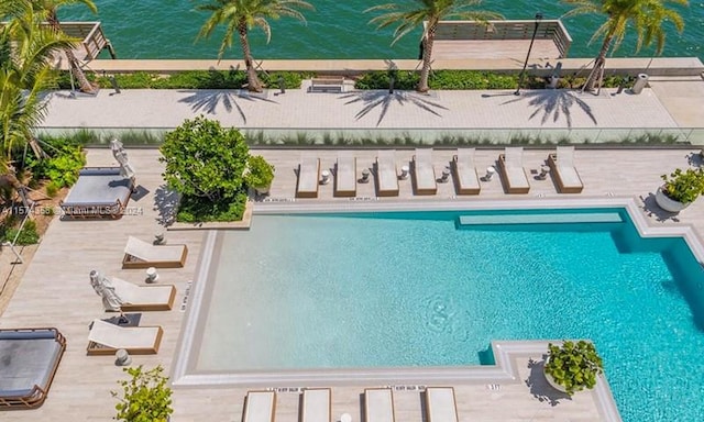 view of swimming pool featuring a patio area