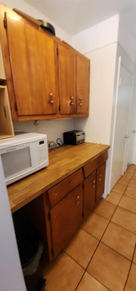 kitchen featuring light tile floors