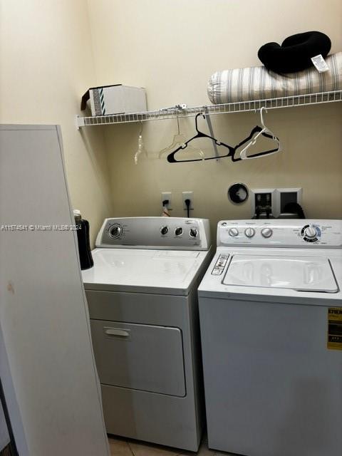 clothes washing area with hookup for a washing machine and separate washer and dryer