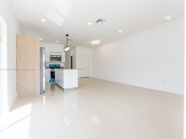 unfurnished living room with light tile patterned flooring