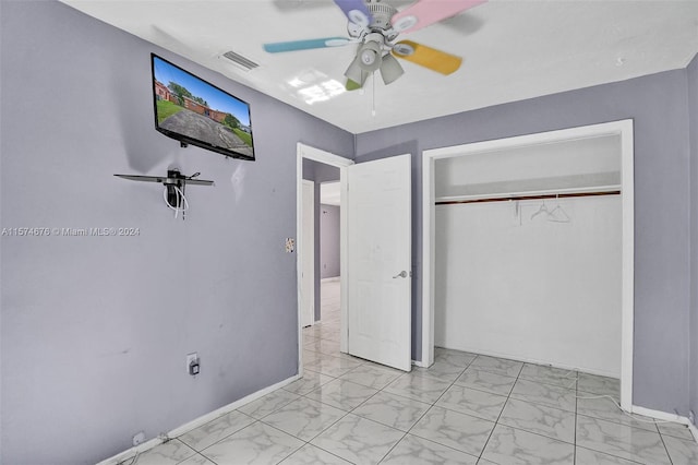 unfurnished bedroom featuring a closet and ceiling fan