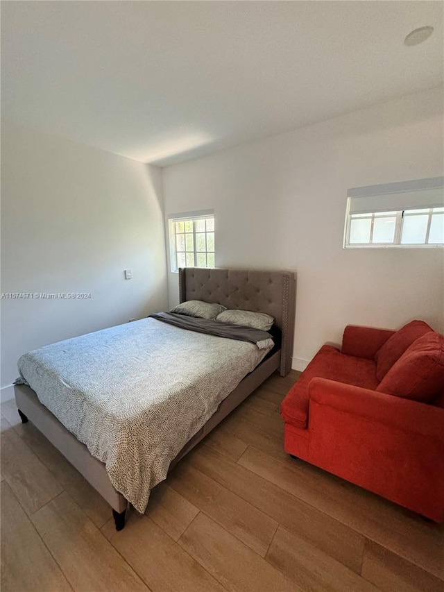 bedroom with wood-type flooring