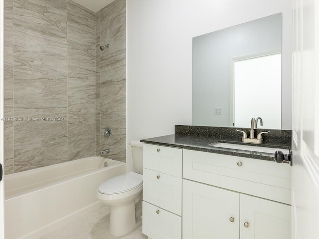 full bathroom featuring vanity, toilet, and tiled shower / bath