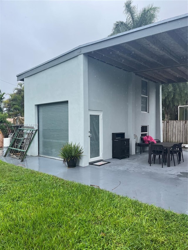 exterior space featuring a yard and a patio area